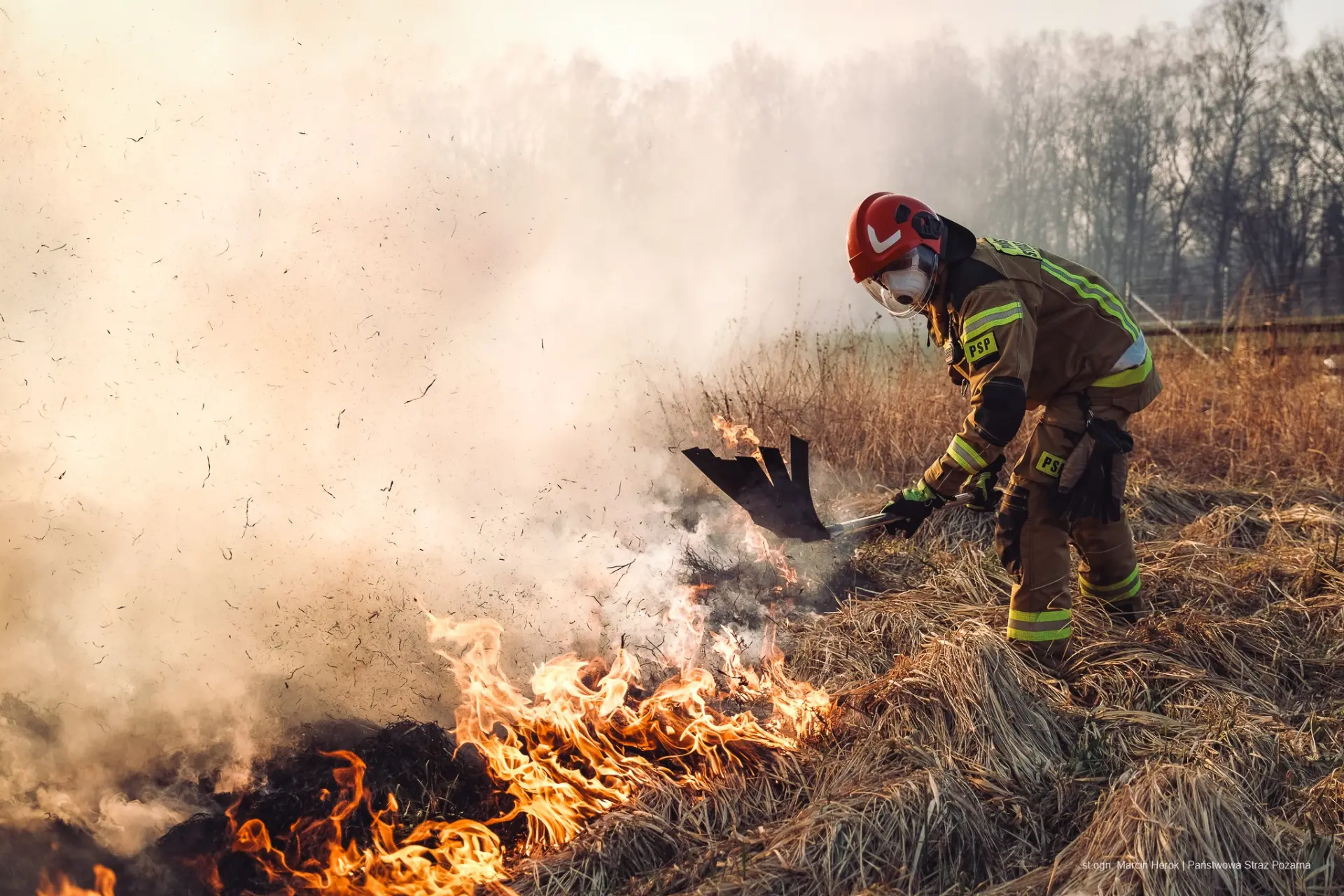 Firefighter in full turnout gear and breathing apparatus during live fire training